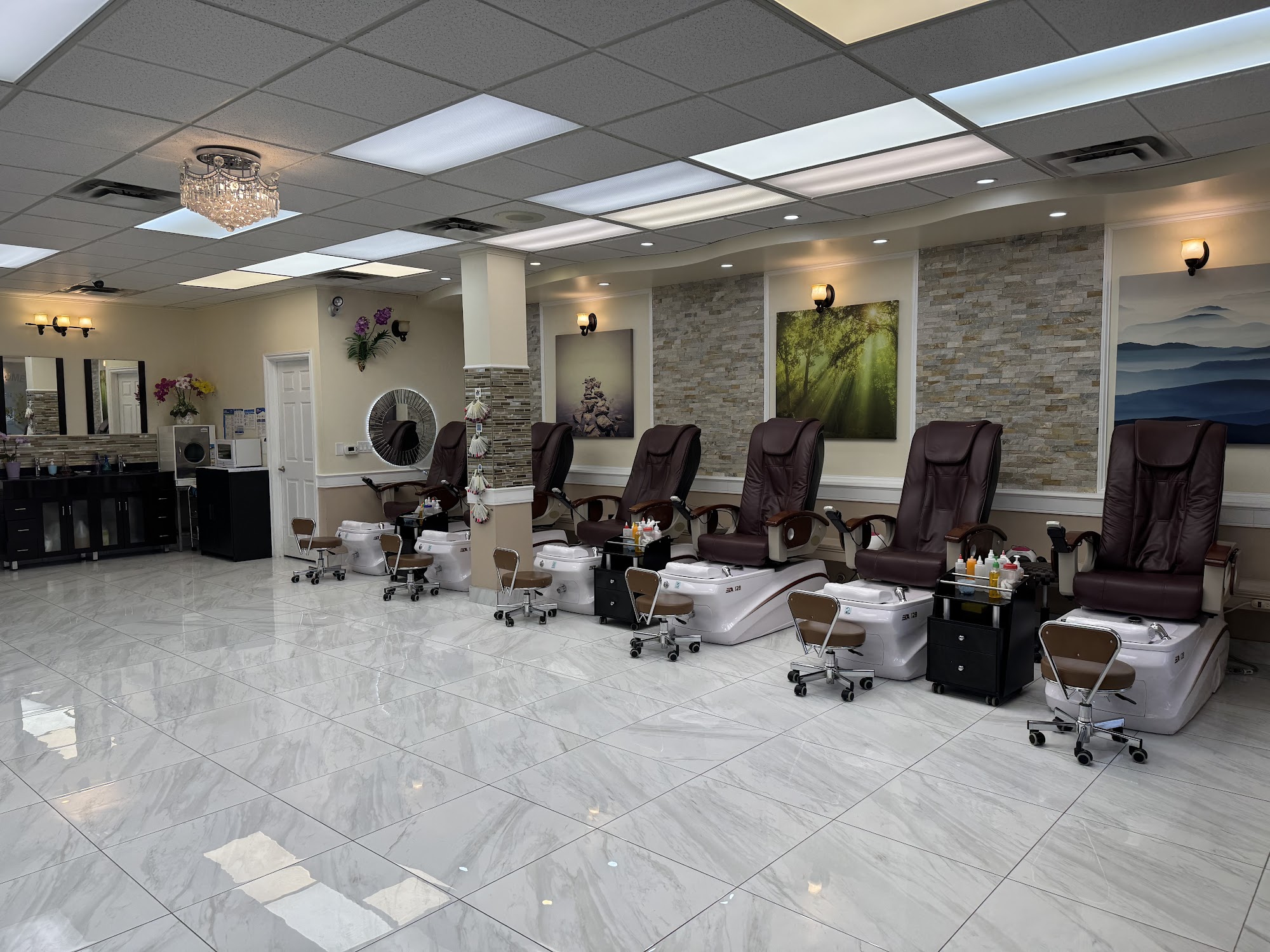Queen Nails Bar spa interior with pedicure chairs and marble floors