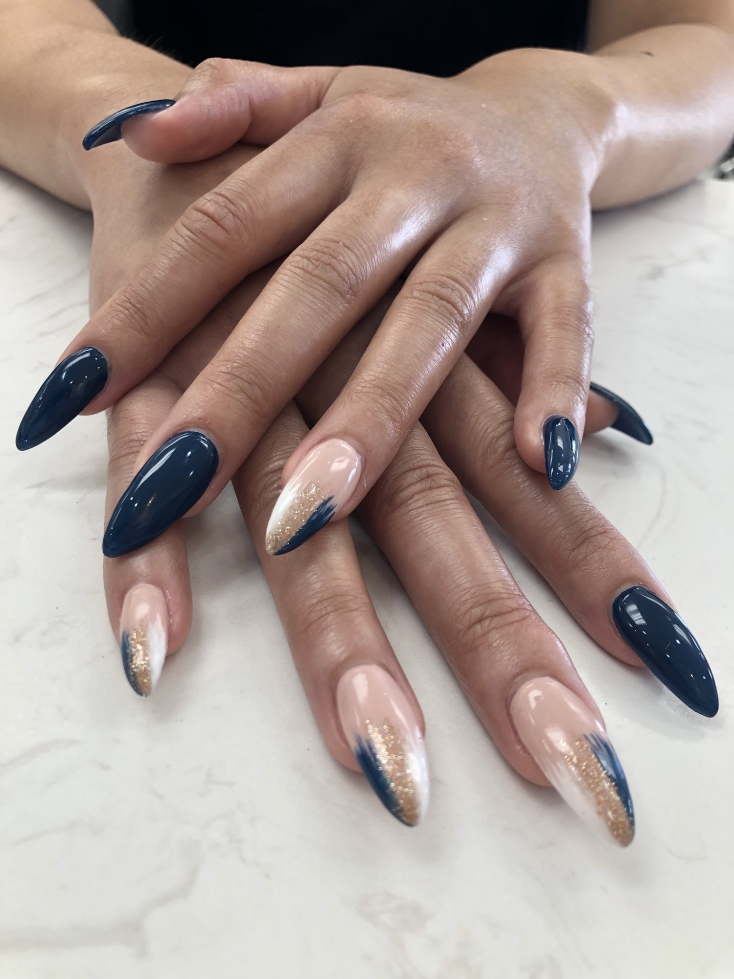 Navy and gold glitter nail art on marble surface, Queen Nails Bar, Woodbridge, Vaughan